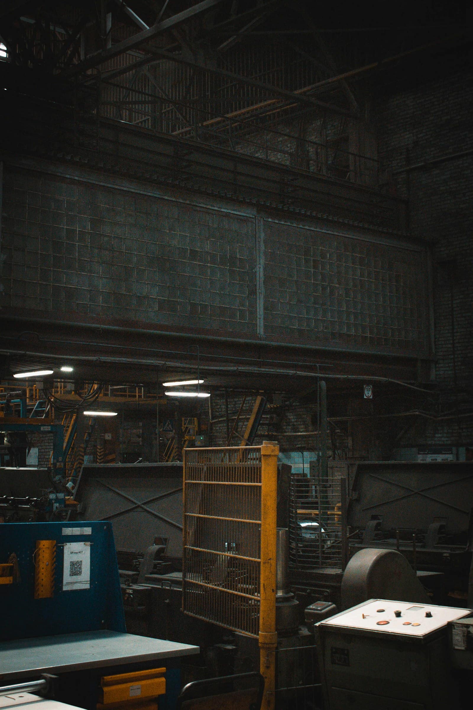 Foaming and forming machines on a dim production hall floor