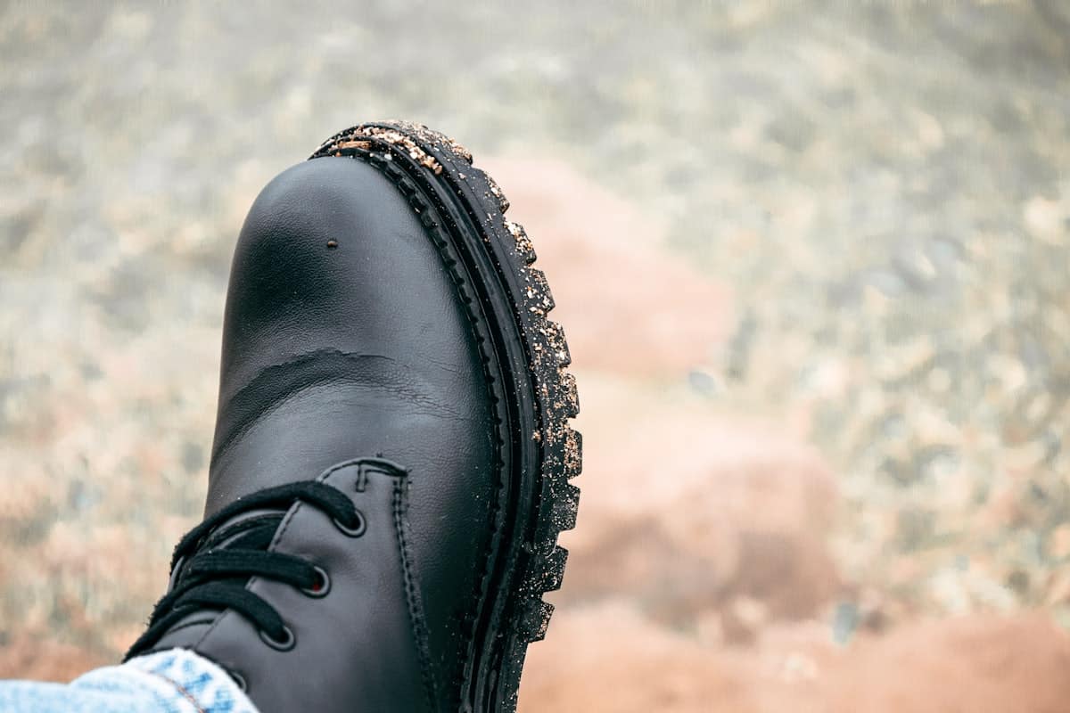 One-piece sole wrapping continuously around the boot edge, no bond line to open up
